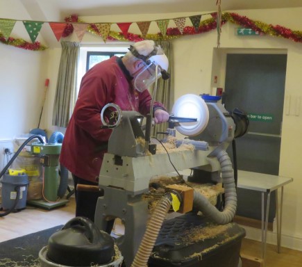 Chris Withall turning a platter on the club lathe